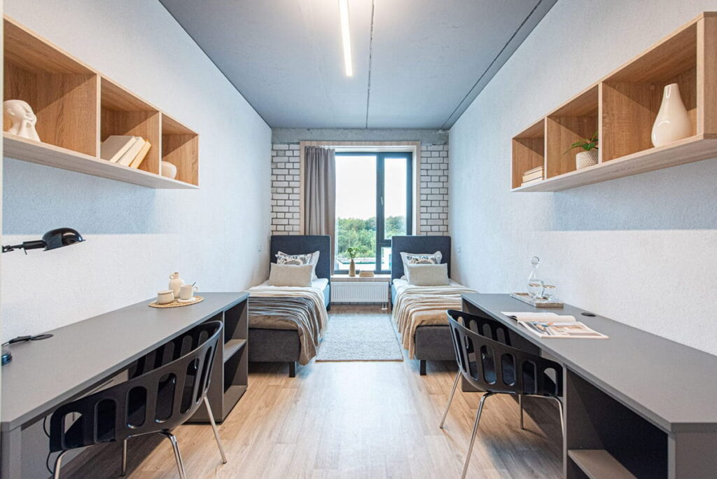 A furnished twin room can reduce the per-person cost while retaining a study desk and storage.