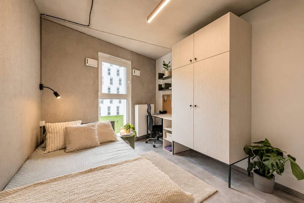 Furnished student room at SHED Campus Living in Warsaw