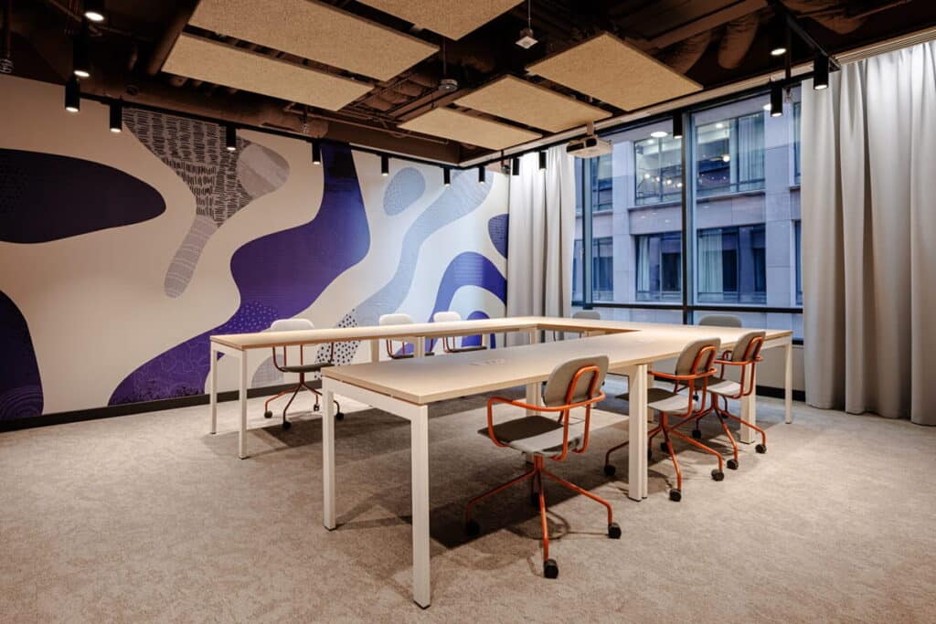 A shared workspace at SHED Sky Living in Warsaw.